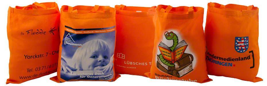 Beispiele für Baumwolltaschen orange 2 kurze Henkel, mit unterschiedlichen Motiven bedruckt