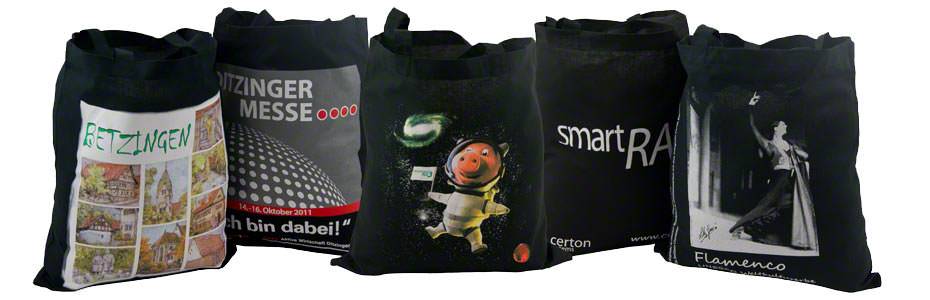 Beispiel für schwarze Baumwolltaschen 2 kurze Henkel, mit unterschiedlichen Motiven bedruckt
